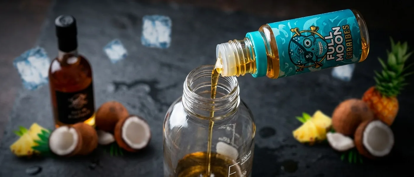 Pouring a longfill concentrate into a larger mixing bottle