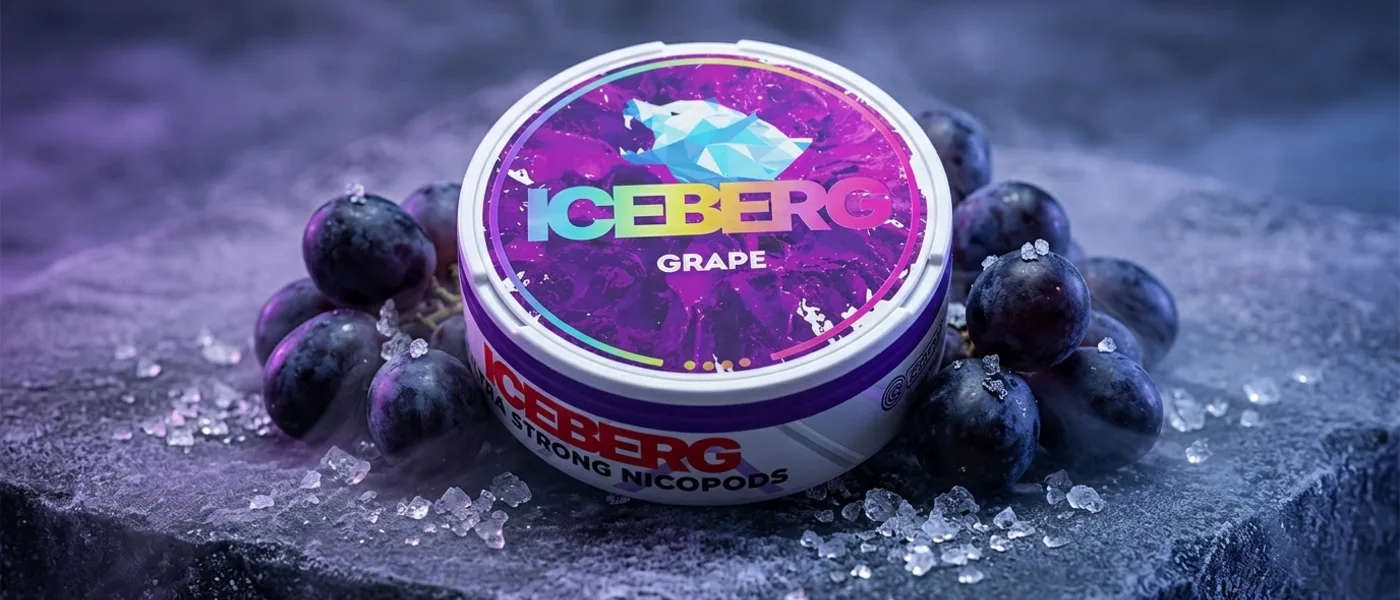 Iceberg Grape nicotine pouch can on ice with dark grapes